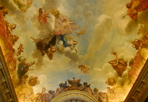 The decorated ceiling of the Salon de Diana, Roman goddess of the hunt, who is associated with the Moon (TK Kuo). The glass chandelier in the Room of Mirrors (Annie Li).