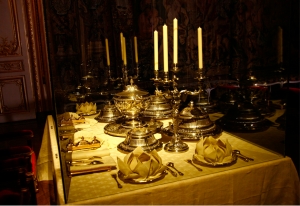 Exquisite eating utensils of the Kings and Queens of France. (Remodeled, as the original set had been destroyed during the French Revolution) (Annie Li). A decorated ceiling in the Palace of Versailles (TK Kuo).