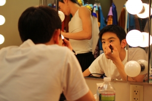 Dancer Peter Huang preparing for a show, 2011. (Sebastien Chun)