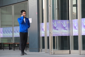 Korean-born dancer Seongho Cha again, this time in front of the Sangmyung Art Center, coordinating with his family about to see the show in Seoul, 2013. (Sebastien Chun)