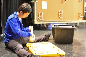 Dancer Henry Huang preparing backstage, 2011. (Sebastien Chun)