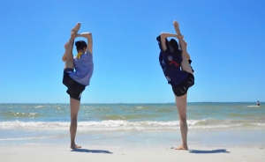 Stretching on the beach - Lily Wang and Vicki Cao practicing a classical Chinese dance technique called chao tian deng - 朝天凳. (photo by Seron Guang Ling Chau)