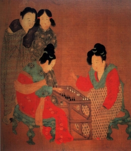 Tang Dynasty painting: Two ladies play a game while their attendants watch on. The colorful silks and elaborate hairstyles of the seated women are an indicator of their higher rank. In comparison, the handmaidens in the background wear simple robes and hair in practical styles.