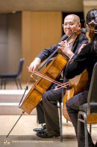 Cellist Yong Deng warms up on stage in Toronto. 
