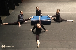 And stretching continues at the theater. Shen Yun International Company dancers at Buell Theatre in Denver, Colorado. Clockwise from 9 o’clock: dancers Jessica Si, Hannah Rao, Yuting Huang, and Connie Kuang. (Photo by projectionist Annie Li)
