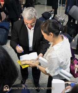 Conductor Milen Nachev is spotted, and stops to sign the first of many autographs.
