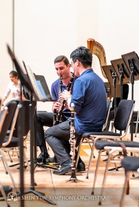 Clarinetists Kiril Penchev and Yuen-Suo Yang work on their synergy.
