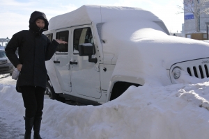 Up north in chilly Montreal, Canada, dancer Ashley Wei poses in front of a snowed in car. (Photo by Principal Dancer Kaidi Wu)
