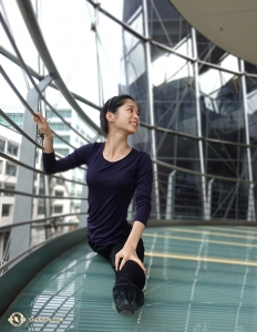 Linjie Huang uses the railing to steady her splits at the Sydney Lyric Theatre. The International Company was in town for seven performances from February 7–11. (Photo by projectionist Annie Li)  
