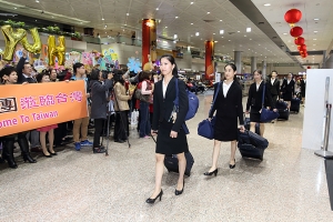 Principal Dancer Elsie Shi followed by other dancers arrive with their luggage in Taiwan. 
