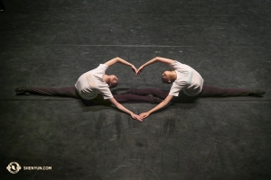 They love performing for you! Dancers Elsie Shi (L) and Olivia Chang from the Shen Yun International Company warm up onstage before one of the last performances in their homeland—Taiwan. (Photo by dancer Kexin Li) 
