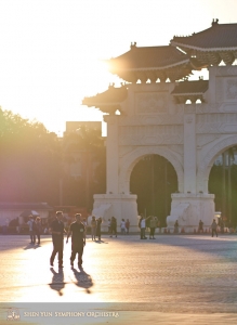 Bass trombonist Pavlo Baishev and French hornist Rumen Marinov take a walk under the sunset at Liberty Square.
