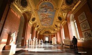 One of the Louvre’s many ornate hallways and ceiling art. (Photo by Annie Li)
