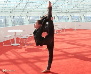 Principal Dancer Xindi Cai takes advantage of the open spaces of the lobby at the Kauffman Center.
