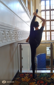 A throwback photo from earlier in this year's tour. Dancer Chengting Cai stretches at the Hippodrome Theatre in Baltimore, MD. (Photo by dancer Sam Pu) 
