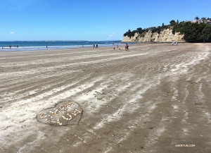 Dancer Betty Wang leaves her mark on the beach of Long Bay Regional Park in Auckland, New Zealand.