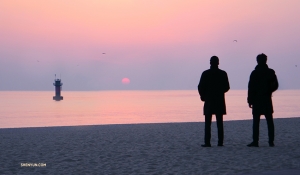 Dancers Jungsu Lee and Jack Han wake up early and watch the sunrise from the beach in Gangneung, South Korea. (Photo by dancer Ben Chen, who also got up early)
