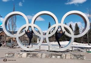 The 2010 Winter Olympics were held right here in Whistler! Dancers Hannah Jao (left) and Sophia Chang use the Olympic rings to aid their stretching. (Photo by Eva Su)
