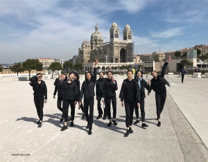 With the Marseille Cathedral in the background, dancers have fun taking a stroll.
