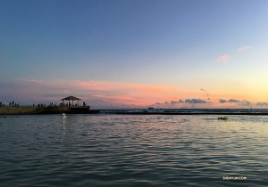 Dancer Betty Wang catches the sunset at iconic Waikiki Beach.
