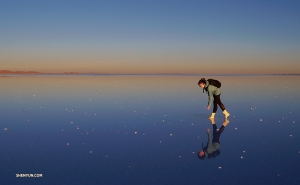 Wading through the salt flats at sunset.