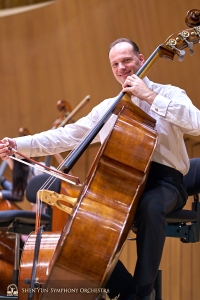 Principal bassist Juraj Kukan having a good time warming up.