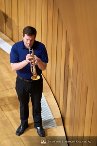 Trumpet player Eric Robins warms up.
