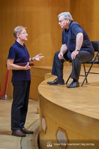 Conductors Milen Nachev and Dmitry Russu in discussion.