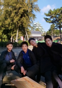 Dancers (from left) Allen Liu, Daniel Sun, Felix Sun, and Piotr Huang take in the castle grounds. (Photo by Tony Zhao)