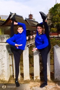 Dancers Lee Rubacek (left) and Stanley Lin hold their legs as straight as stone fence posts. 