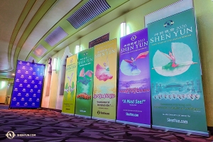 Meanwhile, in London, Shen Yun International Company is greeted by a rainbow of previous year's Shen Yun banners alongside this year's design, at the Eventim Apollo. (Photo by Jeff Chuang)