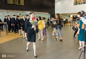 Performers receive a warm welcome at the airport in Peru. 