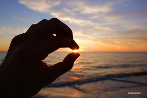 The group enjoys the sunset so much they might just try to take it with them when they leave. (Photo by Jeff Chuang)