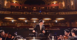 Conductor Chu Yun leads orchestra rehearsal ahead of three shows at the Providence Performing Arts Center, a gorgeous theater built in 1928.