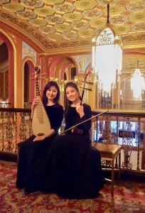 Pipa player Liang Yu (left) and erhu player Junko Takahashi at the resplendent lobby of Providence Performing Arts Center in Rhode Island.