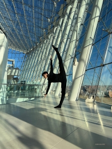 The glass-walled atrium of the Kauffman Center for the Performing Arts, Kansas City, provides the perfect practice space for dancer Pinchun Chan.