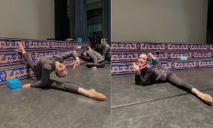 On the other side of the stage, dancer Tara embraces her pre-show stretching session with a smile!