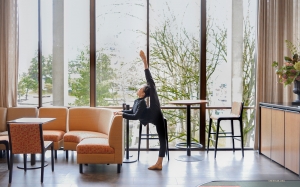 The dancers are always finding a proper moment to stretch, whether in the hotel lounge...