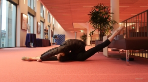 One dancer is bending over backwards to enhance her flexibility.