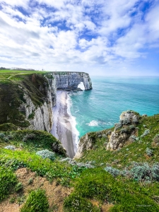 Situated on the Alabaster Coast, Êtretat is a charming French town famous for its stunning white cliffs and is one of Normandy's most popular tourist sites.