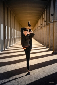 This dancer is enjoying a moment of stillness outside the theater in Ostend, Belgium.