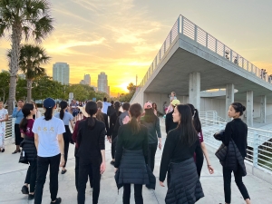 As the sun sets, our dancers take a leisurely stroll after disembarking from their cruise, savoring the simple moments amidst their busy tour schedule.