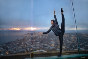 Principal dancer Bella Fan strikes a stunning pose, bringing a ray of light and beauty to the backdrop of a rainy Seattle.