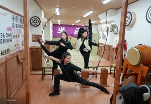After exploring the vibrant streets of Namba, these ladies try their hand at the ancient art of arrow shooting, channeling their inner female warriors.