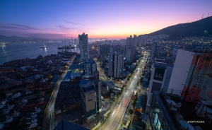 Busan's bright lights and dreamy coastline dazzle from below.