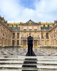An MC makes a grand entrance at the Marble Courtyard, the original courtyard of the Palace of Versailles.