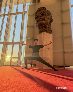 A dancer strikes a pose in the Grand Foyer of the Trump-Kennedy Center in Washington, D.C.