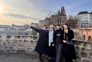 Sunset skies and cheerful smiles along the historic Chemin de la Corniche.