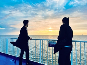 These dancers enjoy the water by boat, on a peaceful ferry ride from Germany to Denmark. 